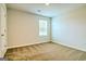 Bright bedroom with window and neutral carpet at 168 Weldon Rd # 18, Mcdonough, GA 30253