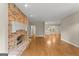 Living room with hardwood floors and brick fireplace at 174 Alexander Dr, Mcdonough, GA 30252