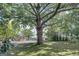Large lot with mature trees and street view at 27 Smith St, Locust Grove, GA 30248