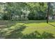 Large grassy backyard with tall ornamental grasses at 27 Smith St, Locust Grove, GA 30248