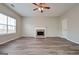 Living room with hardwood floors, fireplace and ceiling fan at 725 Compton Ln, Mcdonough, GA 30253