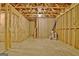 Unfinished basement with exposed framing and wiring at 173 Mulberry Ct, Peachtree City, GA 30269