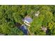 Aerial view showcasing home's setting amongst lush greenery at 109 Rosewood Ct, Peachtree City, GA 30269