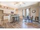 Modern kitchen featuring white cabinets, granite countertops, and an island with seating at 2 Poplar St, Porterdale, GA 30070
