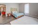 Bedroom with wooden bed frame, white rug, and colorful headboard at 2 Poplar St, Porterdale, GA 30070