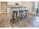 Kitchen island with three metal stools and granite countertop at 2 Poplar St, Porterdale, GA 30070