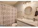 Simple bathroom with a shower and a patterned curtain at 2 Poplar St, Porterdale, GA 30070