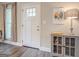 Bright entryway with a white door and decorative sidelights at 2 Poplar St, Porterdale, GA 30070
