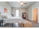 Primary bedroom with a ceiling fan and large windows at 2 Poplar St, Porterdale, GA 30070
