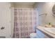 Clean bathroom with shower/tub combo and granite vanity at 2 Poplar St, Porterdale, GA 30070