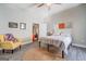 Bedroom with a view into the living room and a yellow chair at 2 Poplar St, Porterdale, GA 30070
