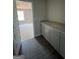 Bathroom with gray vanity and access to a room at 90 Austin Dr, Mcdonough, GA 30252