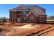 Two-story brick home with a large front yard and landscaping at 90 Austin Dr, Mcdonough, GA 30252