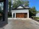 Detached garage with a stylish wood and glass door at 3419 Hamilton Ave, Hapeville, GA 30354
