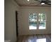 Spacious living area with large windows and hardwood floors at 3419 Hamilton Ave, Hapeville, GA 30354