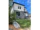 Modern two-story home with grey brick and white accents at 3419 Hamilton Ave, Hapeville, GA 30354