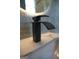 Modern bathroom faucet with a sleek, black design at 3419 Hamilton Ave, Hapeville, GA 30354