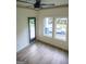 Bright bedroom with hardwood floors and access to a private deck at 3419 Hamilton Ave, Hapeville, GA 30354