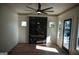 Sunlit living room with a marble fireplace and hardwood floors at 3419 Hamilton Ave, Hapeville, GA 30354