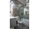 Modern bathroom with a glass shower, bathtub, and stylish tile at 3419 Hamilton Ave, Hapeville, GA 30354