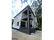 Modern home with a white exterior and a black brick accent wall at 3419 Hamilton Ave, Hapeville, GA 30354