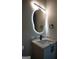 Stylish bathroom with a unique illuminated mirror and quartz vanity at 3419 Hamilton Ave, Hapeville, GA 30354