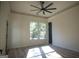 Bright bedroom with hardwood floors, large windows, and ceiling fan at 3419 Hamilton Ave, Hapeville, GA 30354