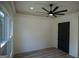 Light and airy bedroom with hardwood floors and double doors at 3419 Hamilton Ave, Hapeville, GA 30354