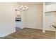 Elegant dining room with chandelier and hardwood floors at 268 Brooks Drive # 77, Fairburn, GA 30213