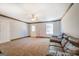 Spacious bonus room with a leather couch and wood accent wall at 1483 Woodlawn Rd, Covington, GA 30014