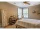 Secondary bedroom with ceiling fan and adjacent kitchenette at 1483 Woodlawn Rd, Covington, GA 30014