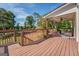 Relaxing deck with wicker furniture and view of yard at 1483 Woodlawn Rd, Covington, GA 30014