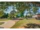 Landscaped backyard with a barn and stone retaining wall at 1483 Woodlawn Rd, Covington, GA 30014