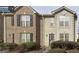 Two story townhome with brick and neutral color exterior at 4403 Pinscher St, Union City, GA 30291