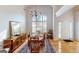 Elegant dining room with hardwood floors, large window, and charming wooden buffet at 1461 Hada Ln, Lawrenceville, GA 30043