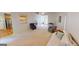Spacious living room with hardwood and carpeted floors, and a view into the kitchen at 1461 Hada Ln, Lawrenceville, GA 30043