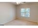 Well-lit bedroom with large window and ceiling fan at 1461 Hada Ln, Lawrenceville, GA 30043