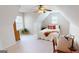 Bedroom with vaulted ceiling, desk, and ceiling fan at 1461 Hada Ln, Lawrenceville, GA 30043