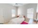 Bright bedroom with window coverings and ceiling fan at 1461 Hada Ln, Lawrenceville, GA 30043