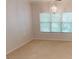 Spacious bedroom with neutral decor and a large window at 1461 Hada Ln, Lawrenceville, GA 30043