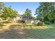House's back view with above-ground pool and a sizable yard at 125 Laney Ct, Mcdonough, GA 30252
