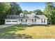 Ranch style home with attached garage and landscaped yard at 125 Laney Ct, Mcdonough, GA 30252