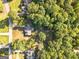 Aerial view showing house, pool, detached workshop, and surrounding woods at 125 Laney Ct, Mcdonough, GA 30252