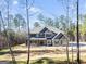 Two-story home with gray siding, stone accents, and a front porch at 980 Temple Draketown Rd, Temple, GA 30179