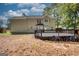 House back view with deck and surrounding yard at 3352 Se Westover Way, Conyers, GA 30013