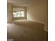 Spacious living room with large window and carpet at 2290 Nicole Dr, Hampton, GA 30228