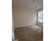 Simple bedroom with carpeted floor and window with blinds at 2290 Nicole Dr, Hampton, GA 30228