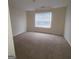 Spacious bedroom with carpeted floor and window with blinds at 2290 Nicole Dr, Hampton, GA 30228