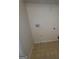 Laundry area with hookups and shelving at 2103 Grove Way, Hampton, GA 30228