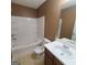 Bathroom includes a bathtub, toilet, and sink at 2103 Grove Way, Hampton, GA 30228